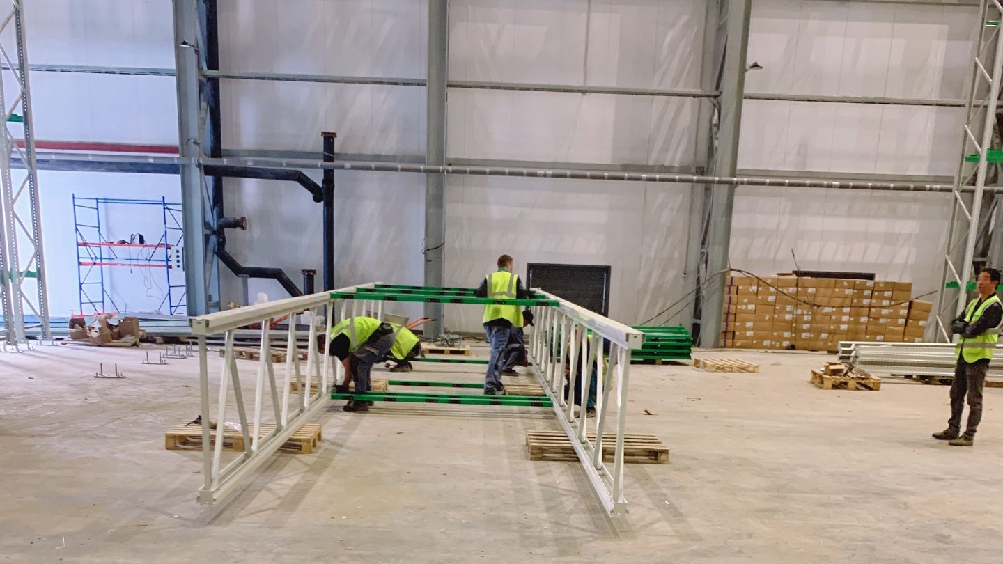 Stacker warehouse column assembly